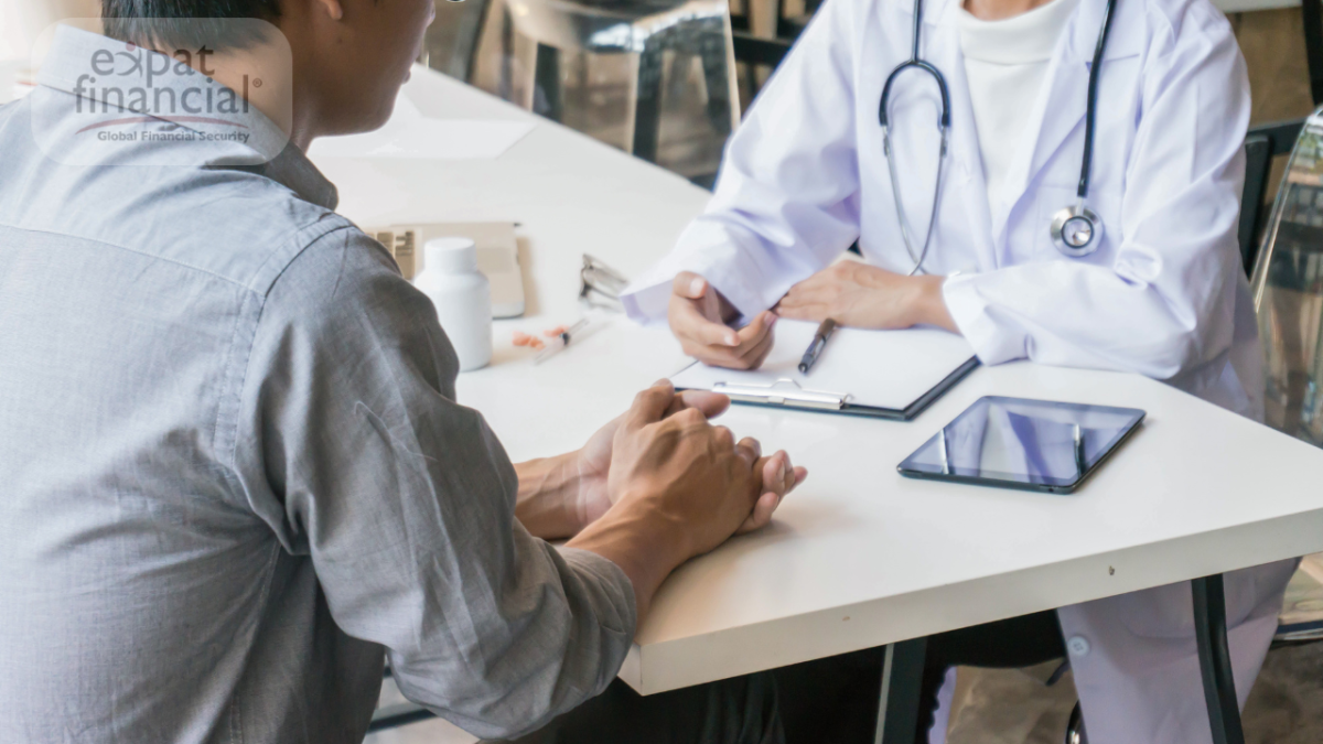Global health plans consultation between a doctor and an international patient discussing medical insurance options.